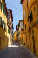 Fototapeta premium alley with old buildings in Lucca, Italy