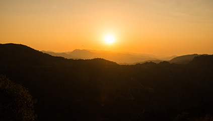 Naklejka na ściany i meble Sunset in the mountains of Troodos