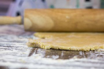 Rolling out sugar cookie dough on the counter top