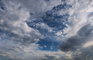 Dramatic sky with white clouds.