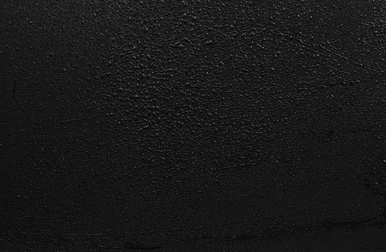 Drops of water on a blackboard