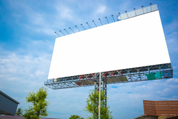 Blank white billboard under blue sky - can advertisement for display or montage product and business