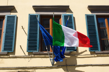 old Italian house with national flag