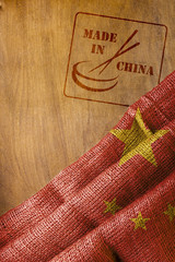 Chinese flag and made in China with chopsticks