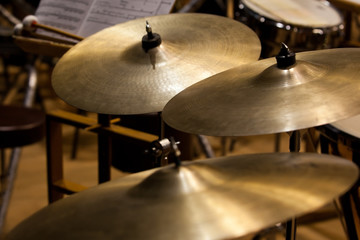 Fototapeta na wymiar Orchestral cymbals closeup in dark colors