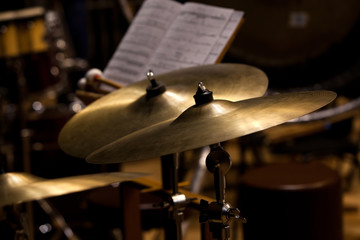Fototapeta na wymiar Orchestral cymbals closeup in dark colors