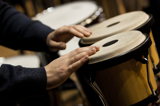  Hands musician playing the bongos