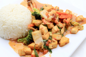 Stir Fried Tofu with Gravy Sauce and mixed vegetables in white plate on white background. Vegetarian Food, healthy food.