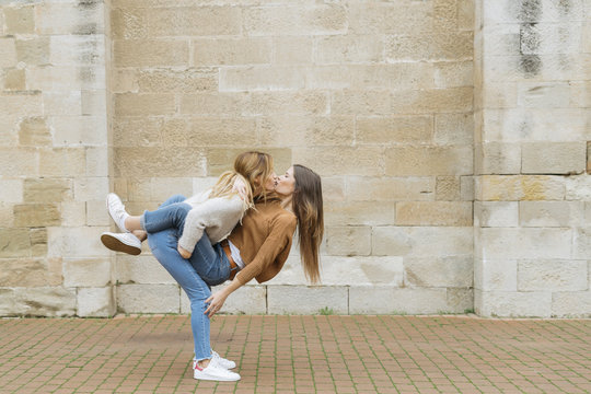 Women hugging and kissing