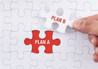 Fototapeta premium Plan A, Plan B on jigsaw puzzle background, business concept