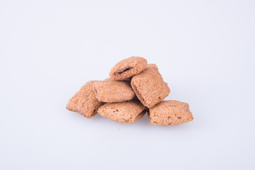 cookie or biscuits filled with chocolate cream on a background.