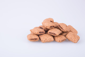 cookie or biscuits filled with chocolate cream on a background.