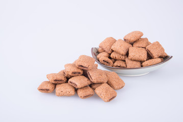 cookie or biscuits filled with chocolate cream on a background.
