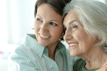 senior mother with adult daughter