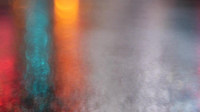 Moody abstract light bokeh on rainy night.  