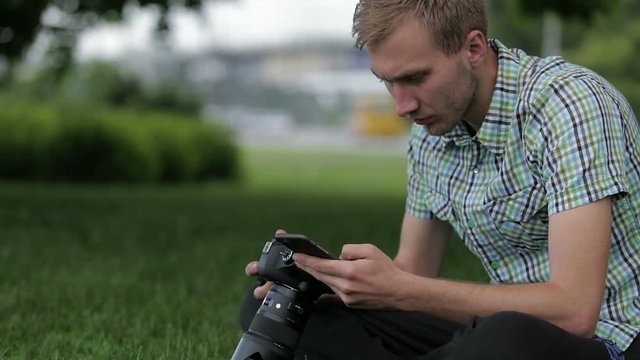 Man sets the camera before taking a picture with your smartphone