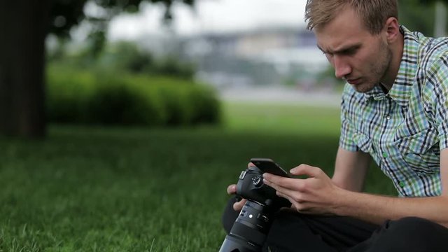 Man sets the camera before taking a picture with your smartphone