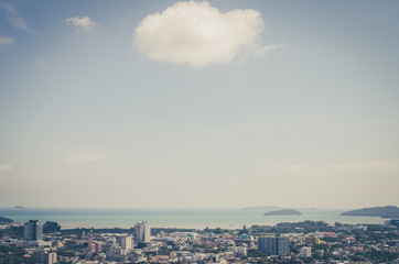Copy space of top view Phuket town Thailand with white clouds and beach background.