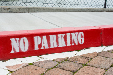Painted red curb with no parking 
