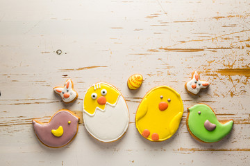 Easter cookies on white wood background
