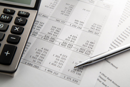 Pen, calculator On the financial account documents. Financial co