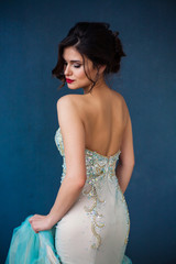 Fashion photo of beautiful lady in elegant evening dress