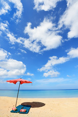 Beautiful sandy beach with umbrella 