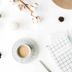 Flat lay trendy creative feminine accessories arrangement with coffee, cotton branch and diary....