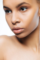 Concentrated Negroid woman posing in the studio