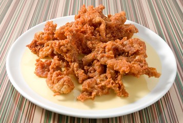 Thai Street Food Deep Fried Chicken Skins on A Dish