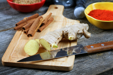 Kitchen knife ginger cinnamon on a chopping board