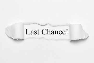 Last Chance! on white torn paper