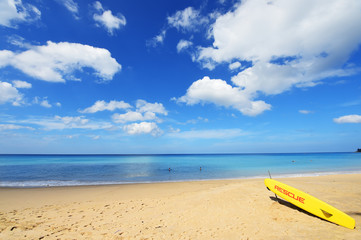 yellow surfboard on the beach
