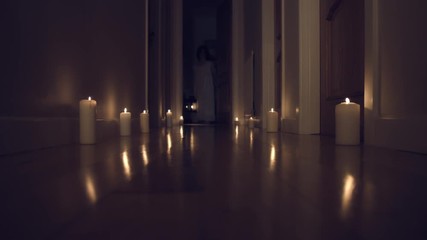 4k Thriller Shot in a Long Hall with Candles, Child walking in with a Chandelier