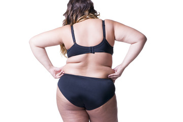 Plus size model in black lingerie, overweight female body, fat woman with cellulitis on buttocks isolated on white background