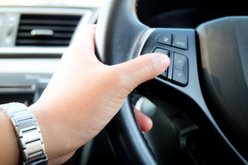 Close up hand driving car