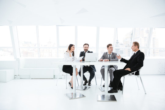 Full length image of Business people in office