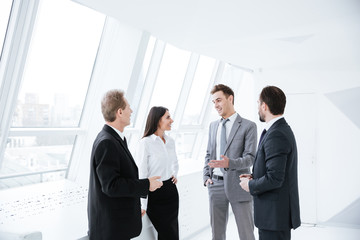 Business team talk near the window