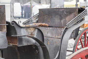 Cooking meat on a large grill