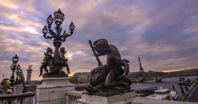 Time lapse sliding view of the Alexandre III bridge in Paris and the river Seine at sunset