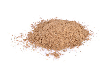 pile of ground nutmeg powder on white background