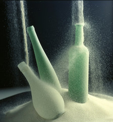 glass bottles studded with quartz sand