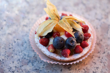 small berry tart on granite table