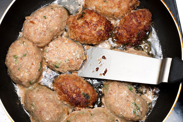 cutlets fried in a pan