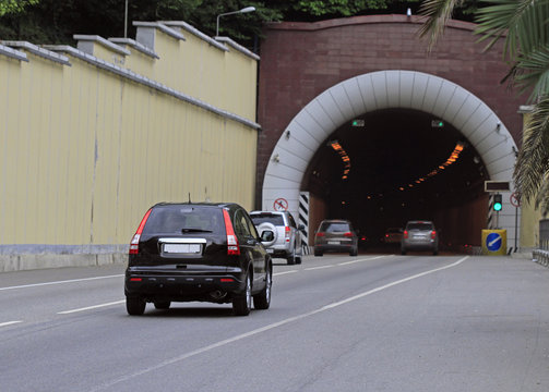 people are riding in cars to and from Khosta tunnel, Russia