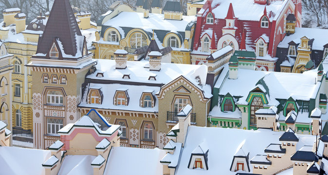 beautiful colored houses and roofs covered with snow