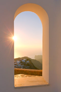 View of Nikia village through an arch of a church, Nisyros island.