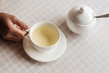 Young African American woman enjoying the cup of tea