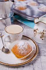 Muffins in powdered sugar