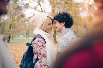 Two Romantic Couples Walking Through Autumn Woodland